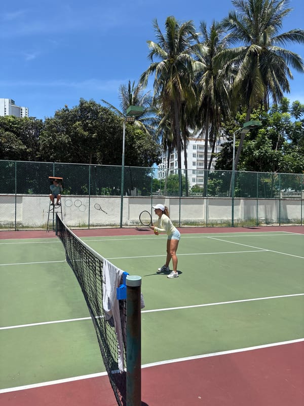 Morning tennis session at an outdoor court in Nha Trang