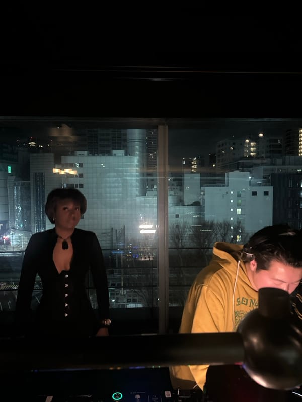 DJ session and social gathering overlooks Shibuya cityscape