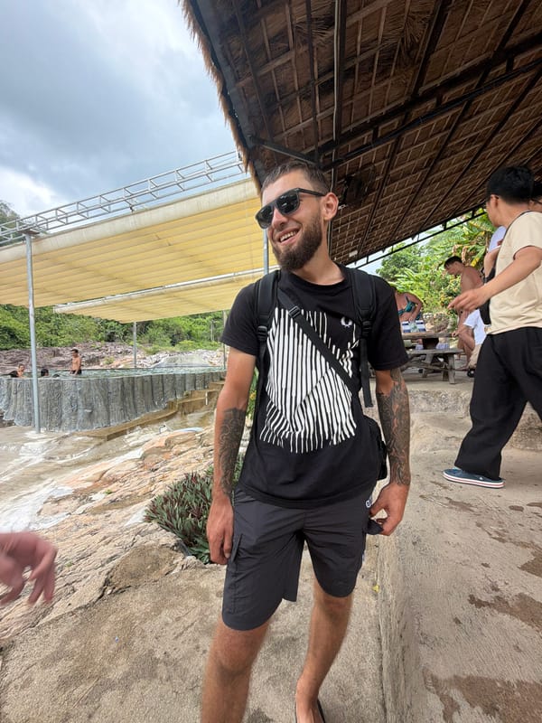 Tourists enjoy waterfall resort activities in Khanh Vinh, Vietnam