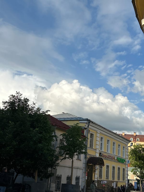 Dramatic clouds blanket unidentified city during afternoon documentation