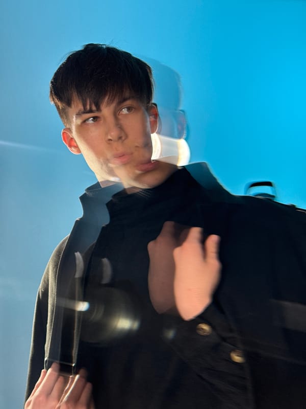 Photo shoot with young man in black suit, Chaikovsky Russia