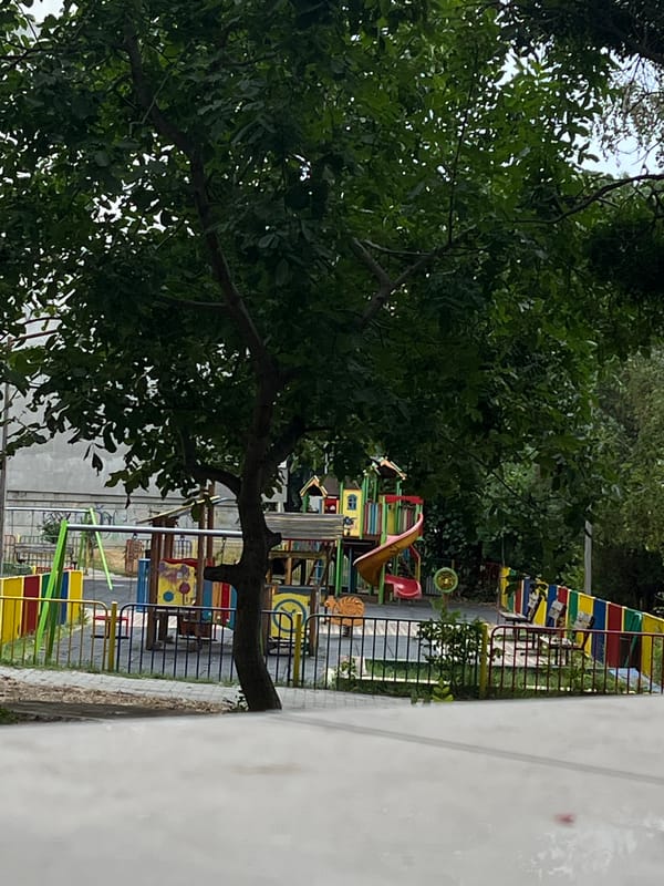 A quiet Varna morning — park, apartment windows, and guitar