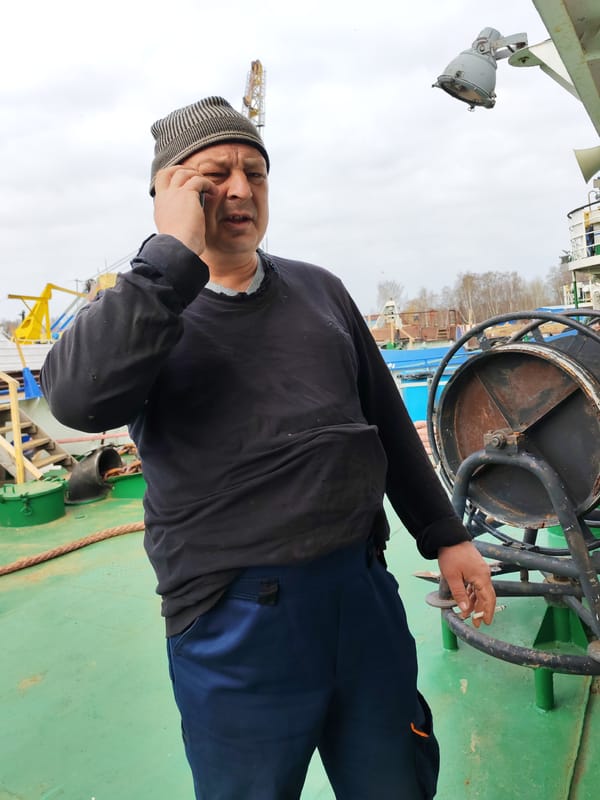 Man smoking on industrial vessel deck in Rybinsk
