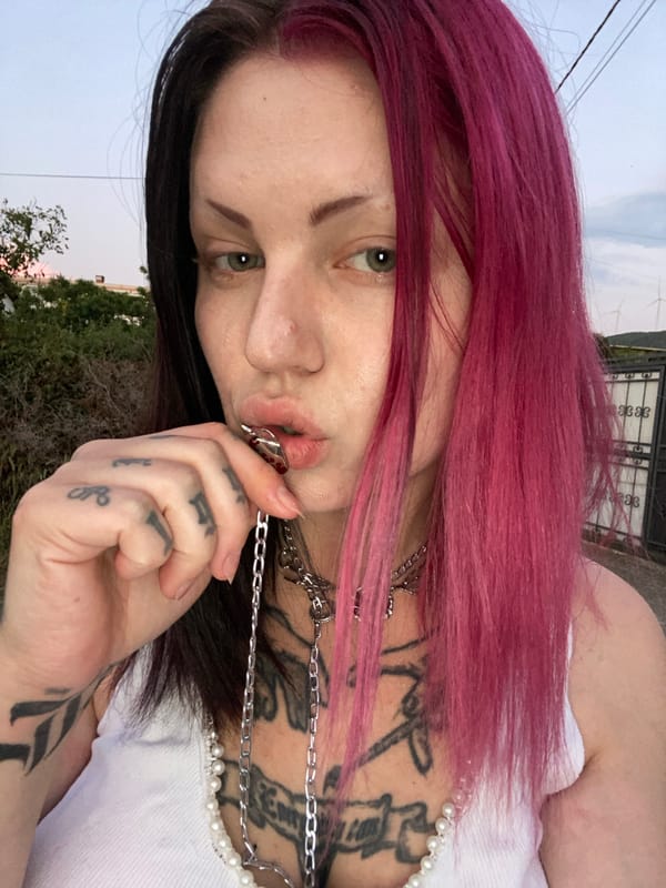 Woman takes street selfies in Kunje, Montenegro
