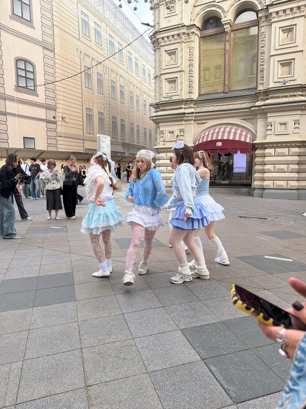 Young women pose at Moscow's GUM department store