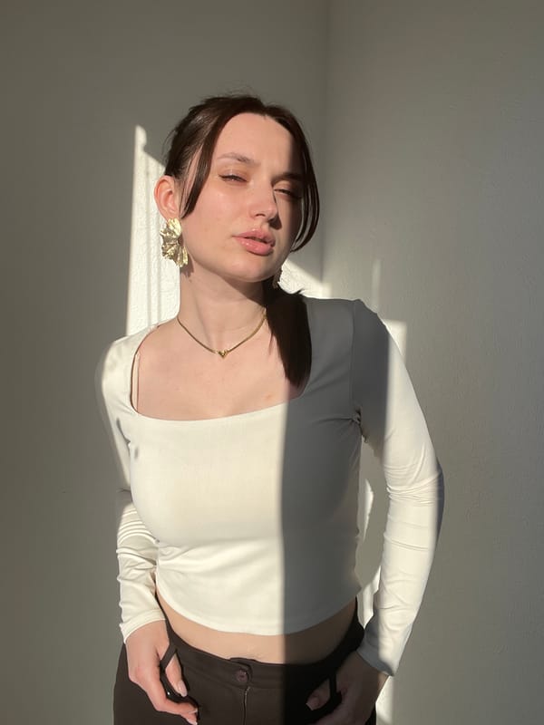 Woman photographed in multiple poses indoors in Tyumen