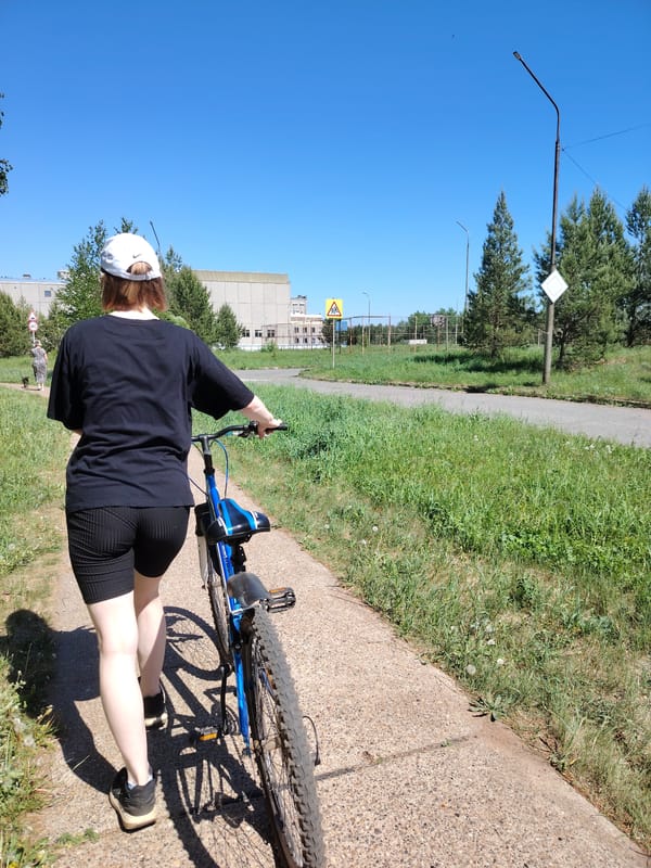 Morning scenes captured in Марковский: cyclist and two women