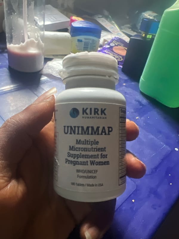 Prenatal supplement bottle documented in Nigeria village