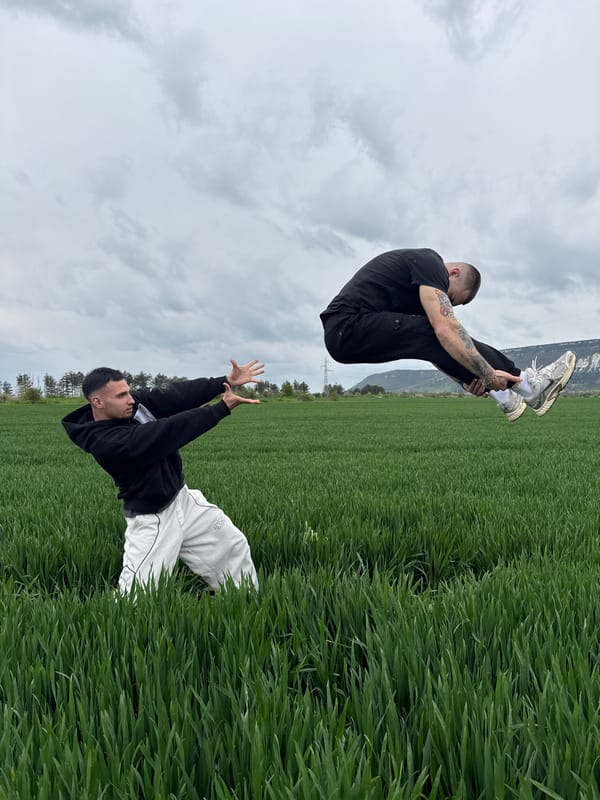 Men practice acrobatics in Bulgarian field