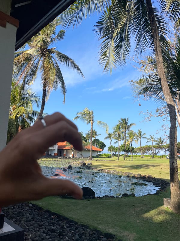 Bali resort grounds and beach on a quiet tropical morning
