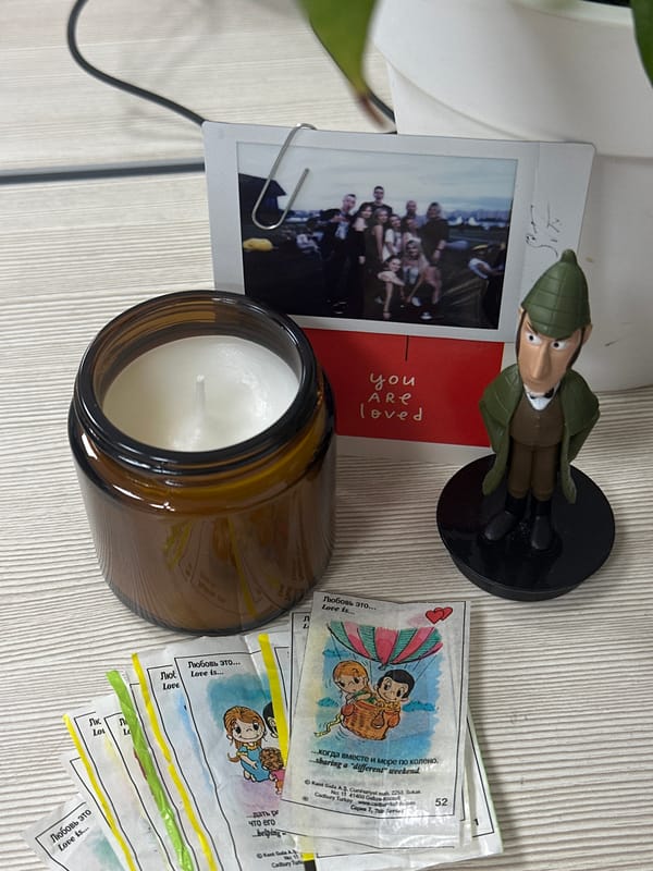 Personal items with photograph documented on wooden surface in Kazan