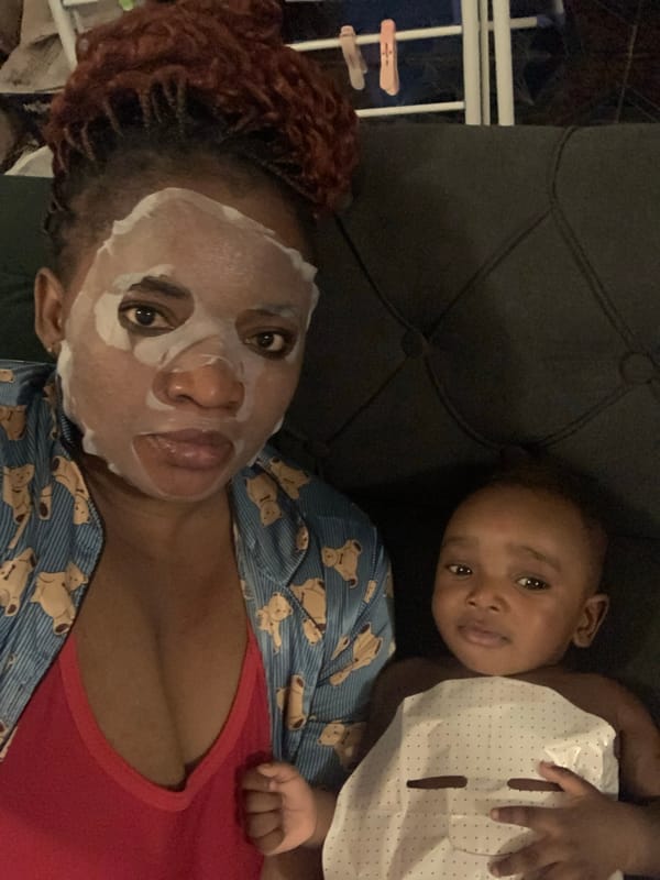 Mother and baby share quiet skincare time in Nigeria