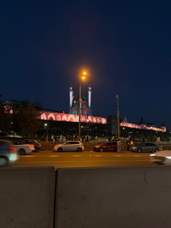 Evening crowds gather at illuminated Kul Sharif Mosque in Kazan