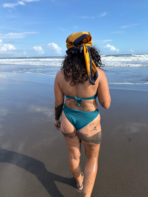 Woman enjoys sunny morning at Indonesian volcanic beach