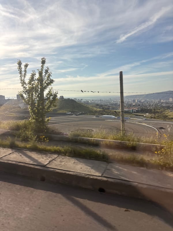 Early morning taxi ride documented across Tbilisi cityscape
