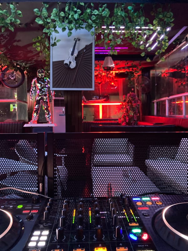 DJ set at Abuja nightclub with digital mixing setup
