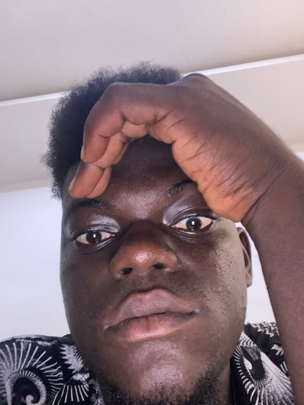 Young man documents himself in production space with equipment