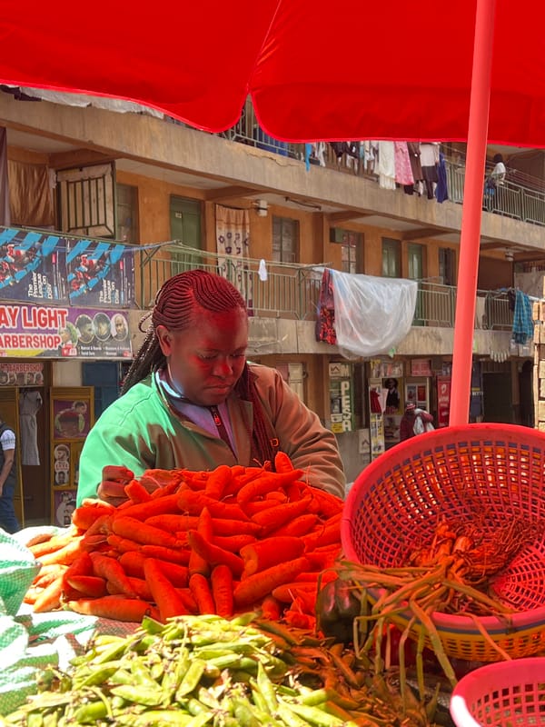 Street vendor sells fresh vegetables in Nairobi market