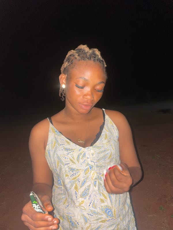Evening gatherings documented in dimly lit Ogbe, Nigeria
