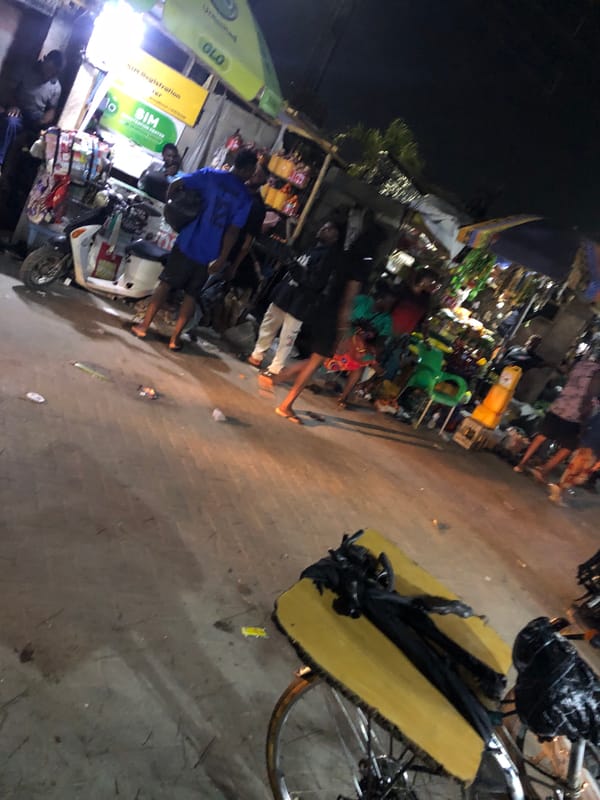 Evening street life documented in Moba, Nigeria commercial district