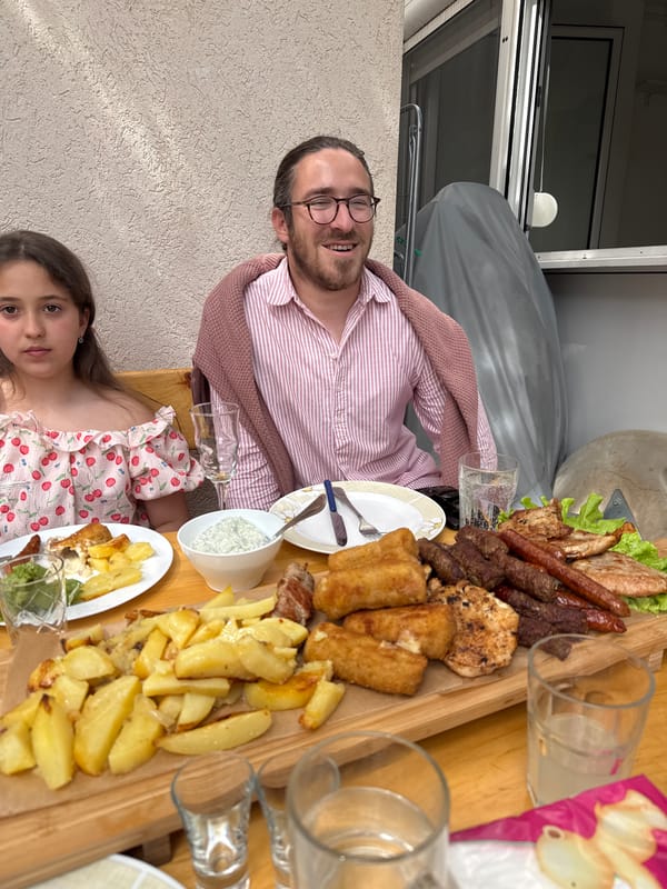 Family meal enjoyed at coastal restaurant in Montenegro