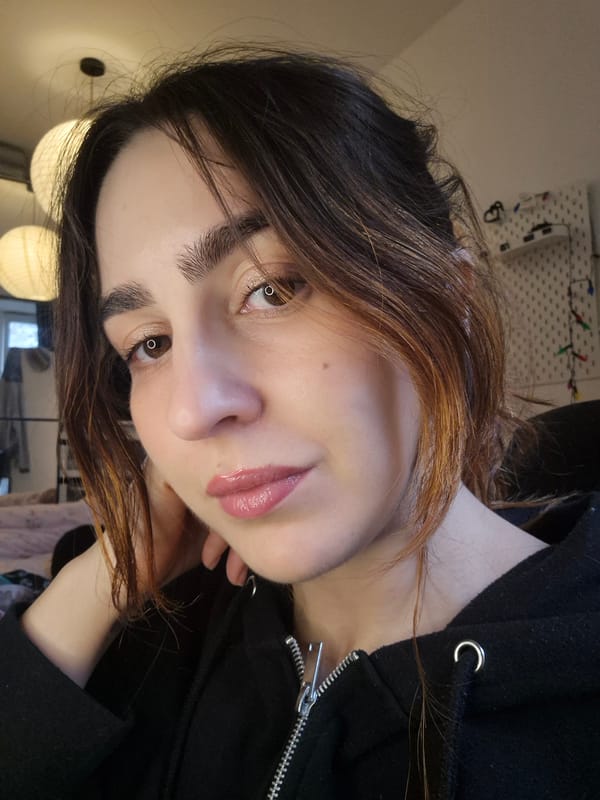 Woman takes beauty selfies indoors in Strasbourg