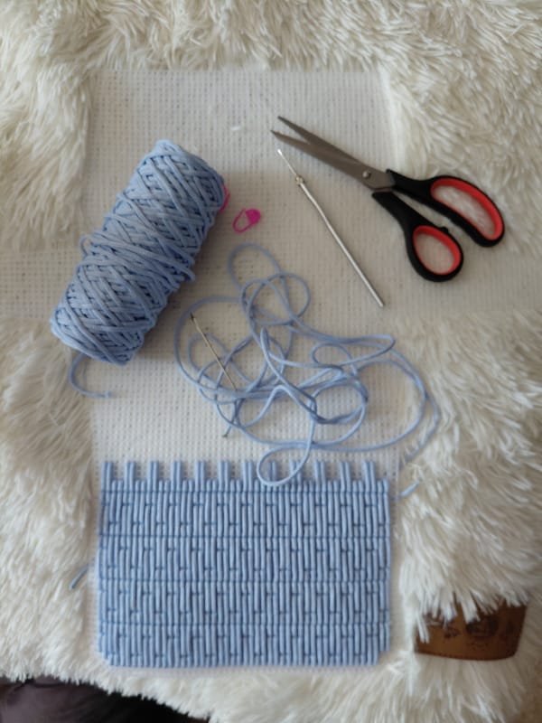 Crochet supplies laid out mid-project in Novosibirsk