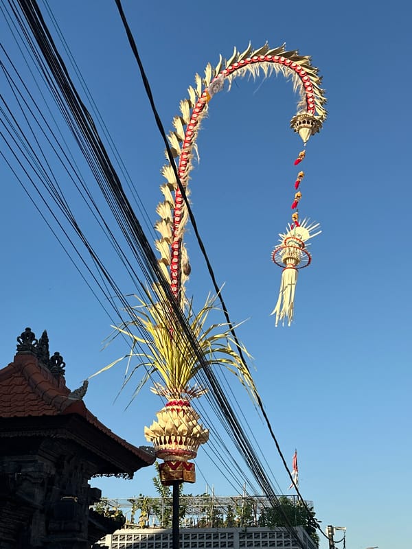 Sunny morning in North Kuta, wires overhead and shades on