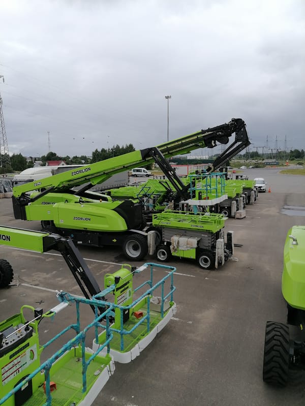 Zoomlion construction equipment staged and loaded at Russian yard