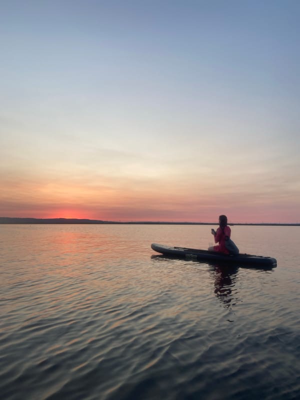 Paddleboarding on the Kama River at golden hour
