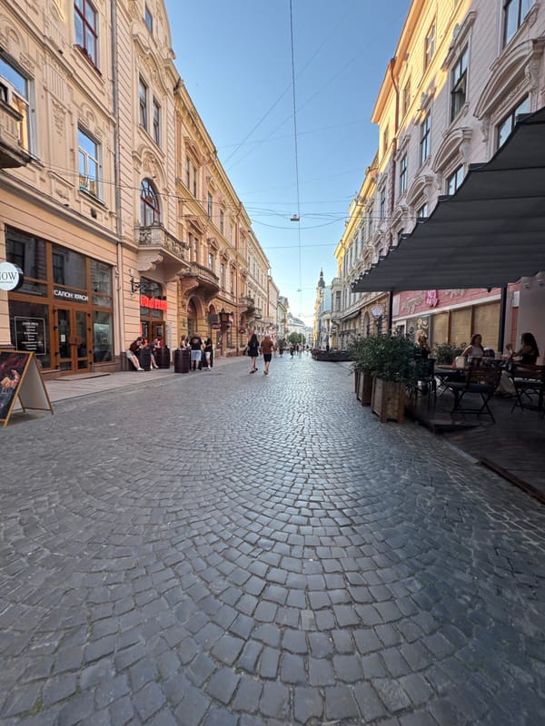 Late afternoon street life on Chernivtsi's historic cobblestone center