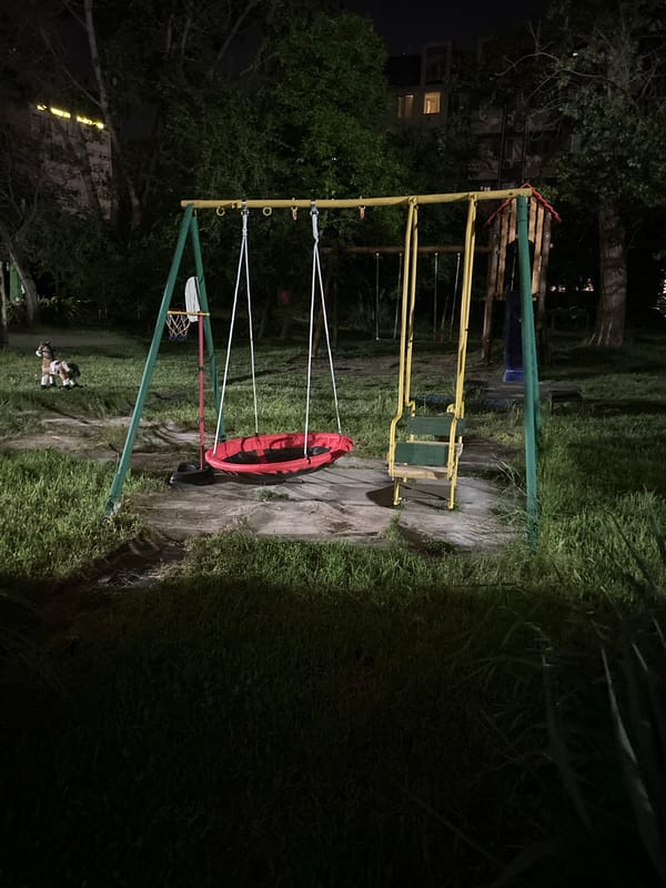Nighttime playground structure observed under artificial lighting