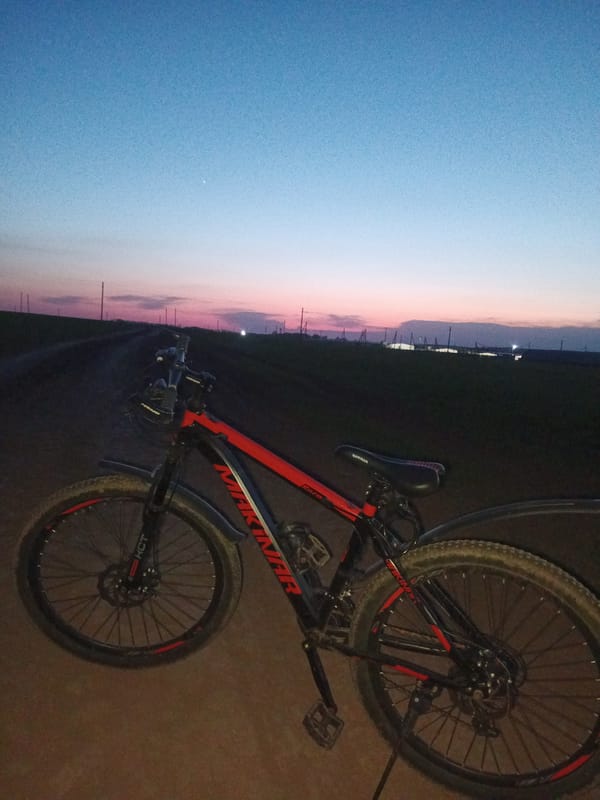 Woman photographs evening bike ride in rural Russia
