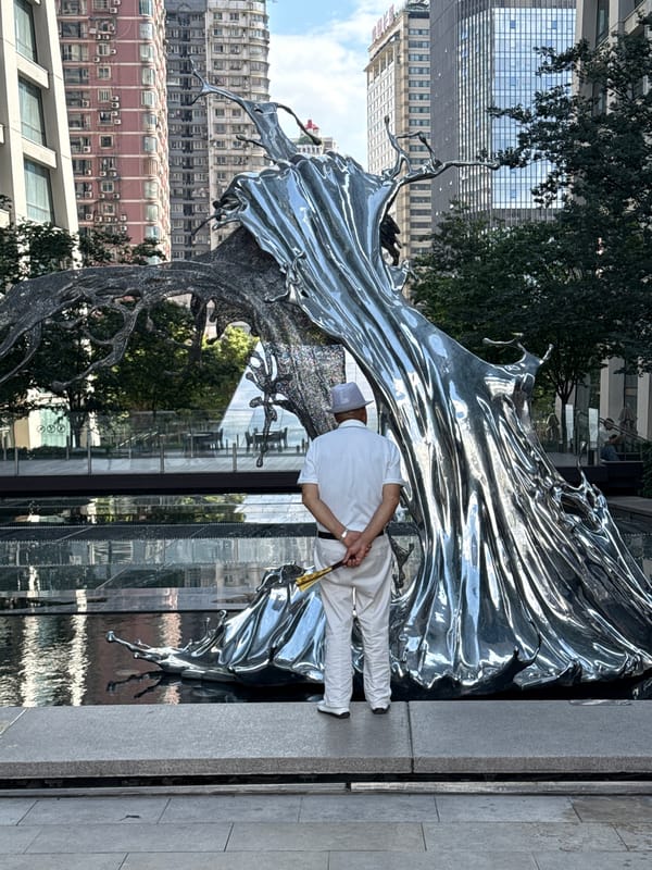 Around a striking metallic sculpture in Chongqing's Yuzhong District