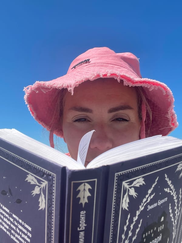 Lazy morning at a pebble beach — reading, swimming, parasailing