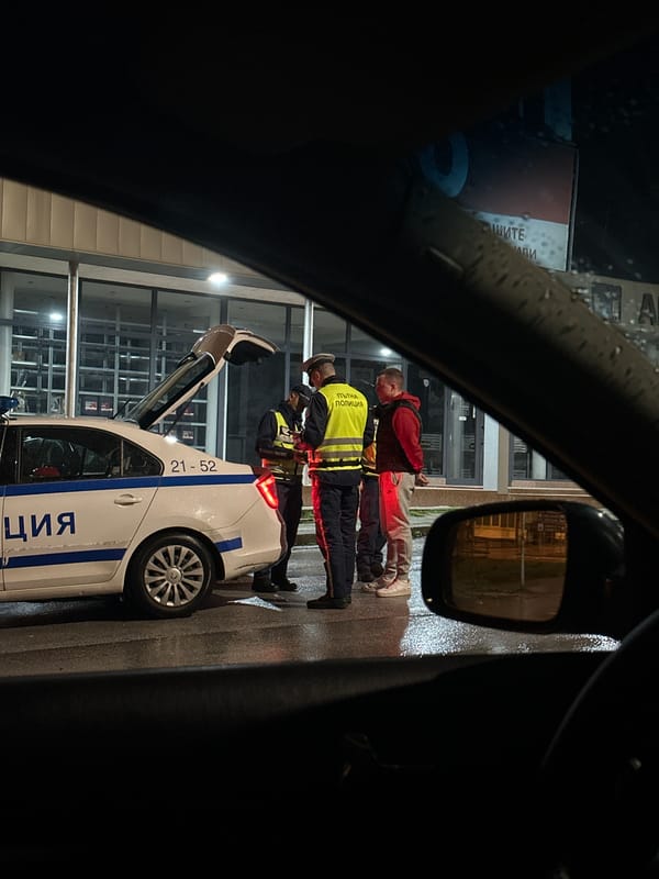 Police conduct traffic stop in rainy Smolyan evening