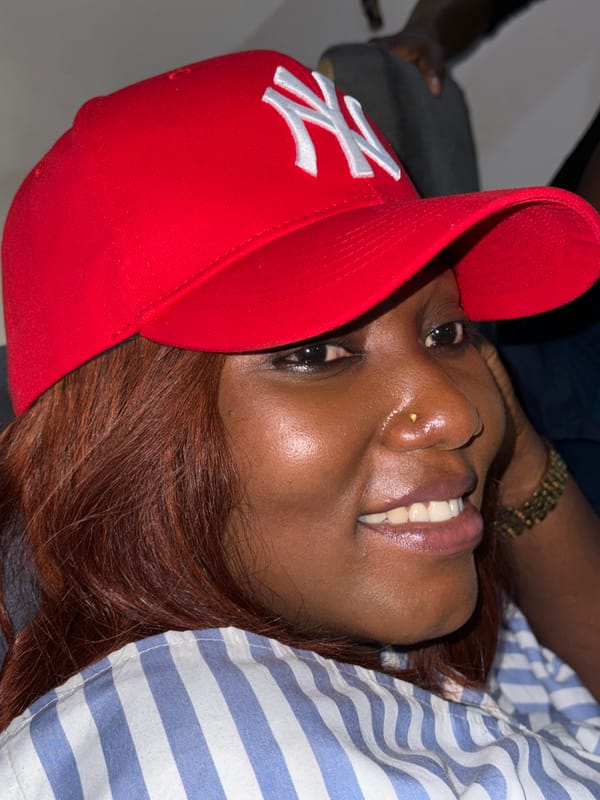 Woman in Yankees cap photographed in Ado, Nigeria