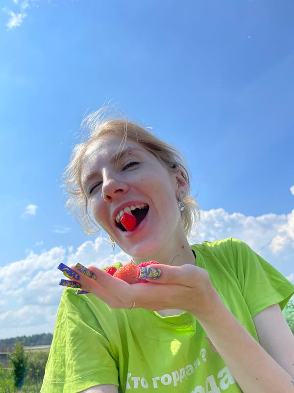 Summer day on a Russian farm: berries and a rooster