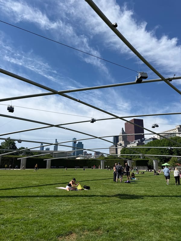 Outdoor yoga class on the lawn at Millennium Park