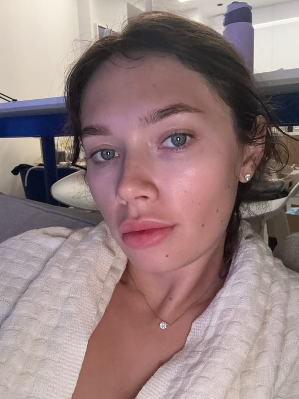 Woman takes selfies wearing diamond jewelry in Cyprus