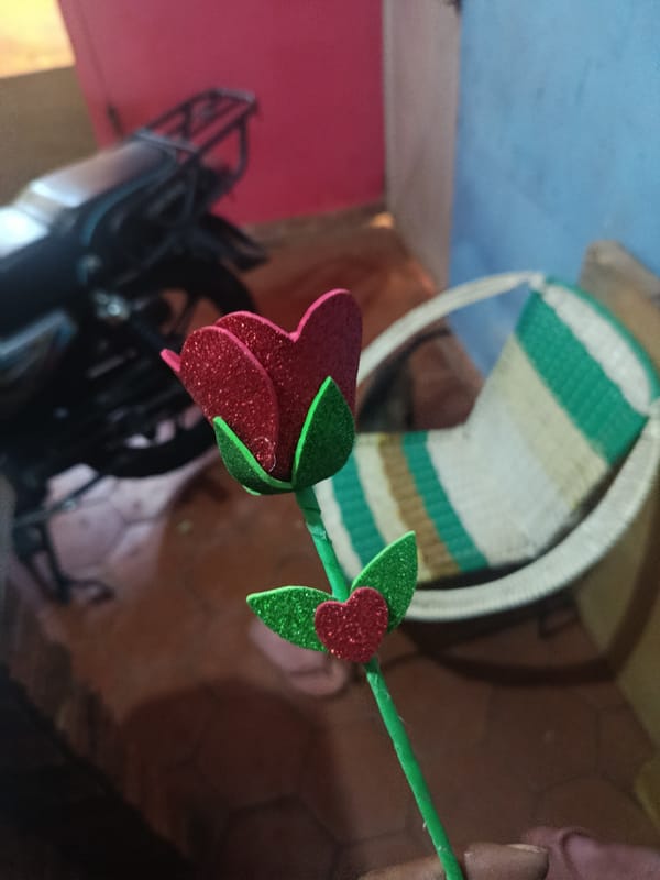 Everyday moments with puppy and decorative rose documented in Venezuela