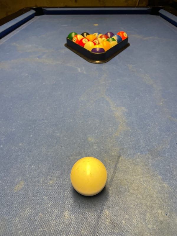 Evening pool game documented at Budapest restaurant district