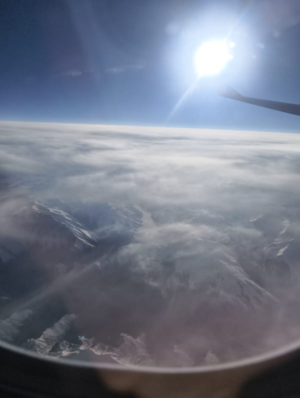 AirAsia passenger captures aerial mountain and landscape views during flight