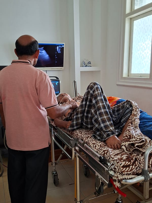 Elderly patient undergoes ultrasound at Indonesian health clinic