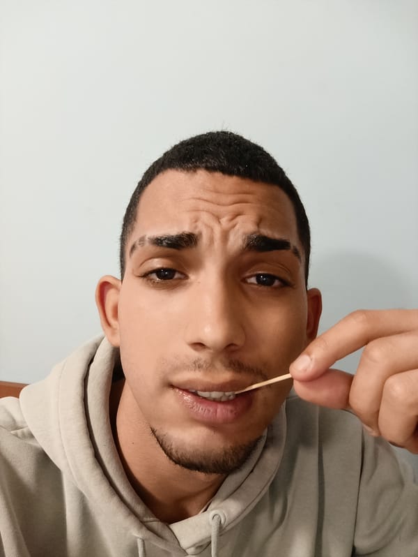 Man using toothpick captured in indoor moment in Bulgaria