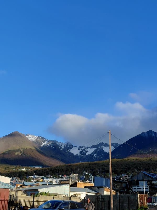 Clear skies frame Ushuaia against Andes Mountains backdrop