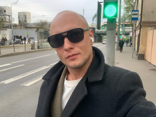 Bald man with sunglasses photographed on Moscow street