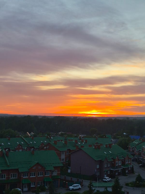 Witness documents vibrant sunset over unknown city residential area