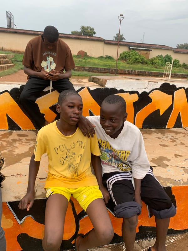 Daily life and conversations in Jos, Nigeria during rainy weather