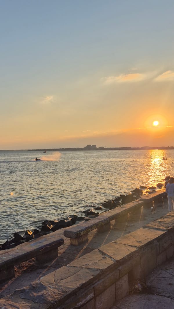 Summer evening on the Pomorie promenade, fairground and sea views